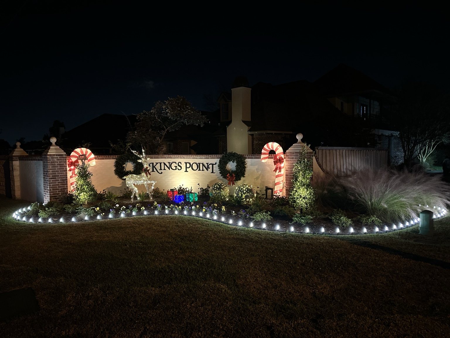 HOA neighborhood entrance holiday lighting